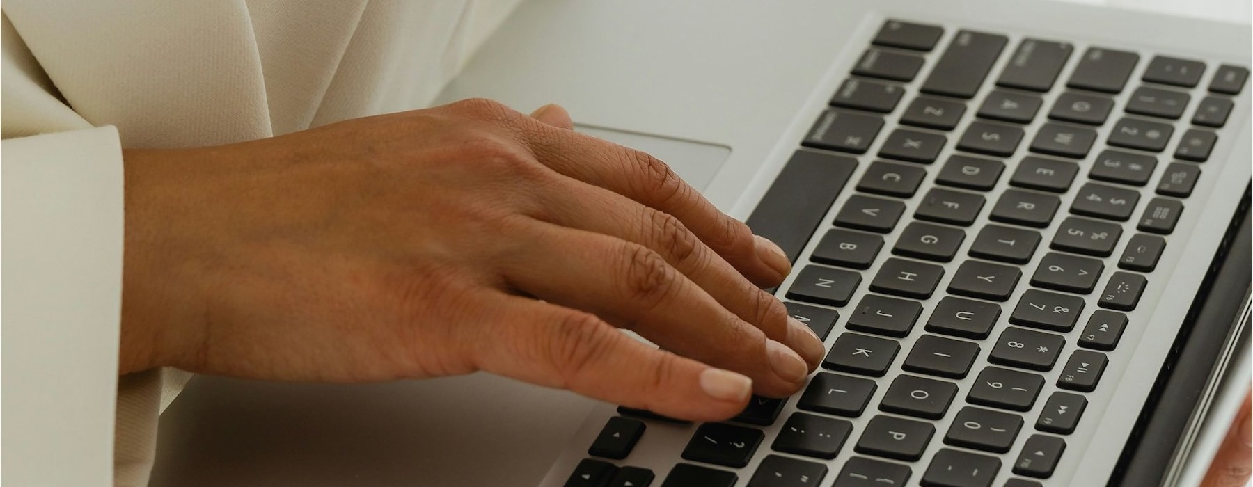 a woman typing on a computer