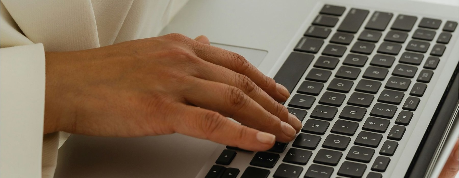 a woman typing on a computer