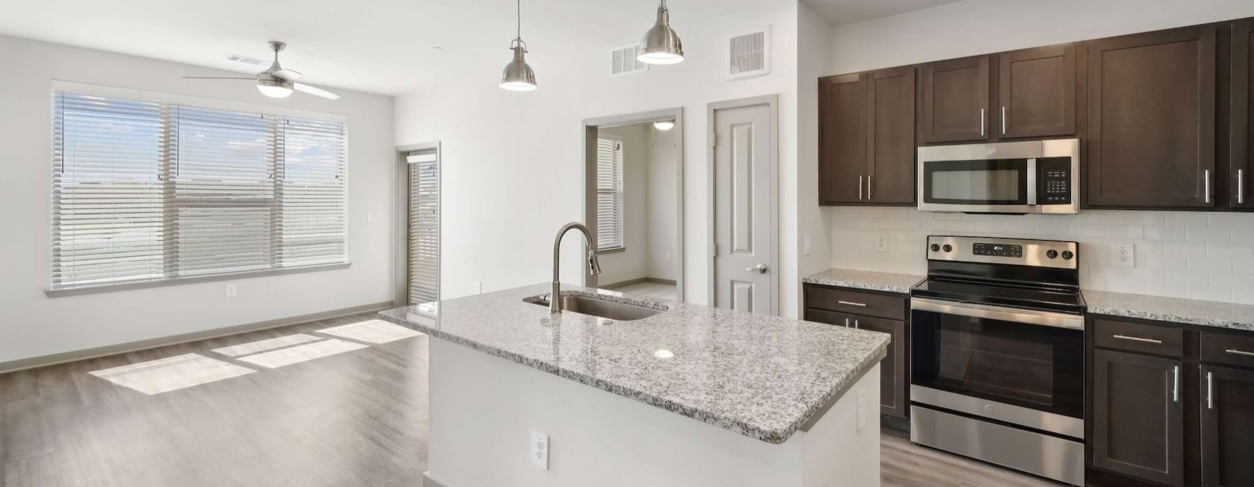 a kitchen with wood cabinets